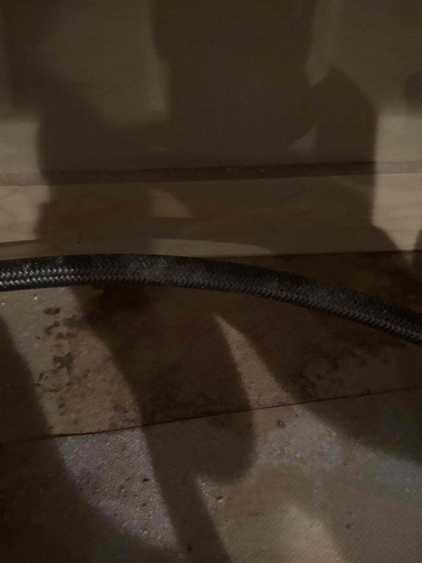 Responded to a reported leak at the faucet base and inspected the sink's braided flexible supply line and surrounding cabinet surface, which showed staining consistent with prior moisture exposure. Verified system water pressure using a Watts pressure gauge, with readings indicating the system was within a range appropriate for testing connections. Evaluated the sink as requested and confirmed the leak source for the customer. Responded to a reported leak at the faucet base and inspected the sink's braided flexible supply line and surrounding cabinet surface, which showed staining consistent with prior moisture exposure. Verified system water pressure using a Watts pressure gauge, with readings indicating the system was within a range appropriate for testing connections. Evaluated the sink as requested and confirmed the leak source for the customer.