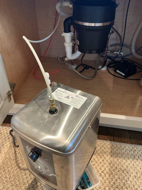 Installed a new instant hot water dispenser tank under the sink and connected it to the cold water supply and dispenser faucet. Restored water pressure at the faucet and repaired the sink stopper so the basin drains properly. Verified all connections, drain piping, and the P-trap were secure and dry with no leaks. Installed a new instant hot water dispenser tank under the sink and connected it to the cold water supply and dispenser faucet. Restored water pressure at the faucet and repaired the sink stopper so the basin drains properly. Verified all connections, drain piping, and the P-trap were secure and dry with no leaks.