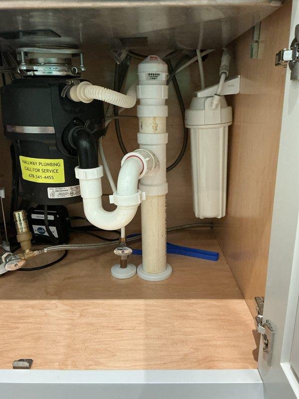Installed a new instant hot water dispenser tank under the sink and connected it to the cold water supply and dispenser faucet. Restored water pressure at the faucet and repaired the sink stopper so the basin drains properly. Verified all connections, drain piping, and the P-trap were secure and dry with no leaks. Installed a new instant hot water dispenser tank under the sink and connected it to the cold water supply and dispenser faucet. Restored water pressure at the faucet and repaired the sink stopper so the basin drains properly. Verified all connections, drain piping, and the P-trap were secure and dry with no leaks.