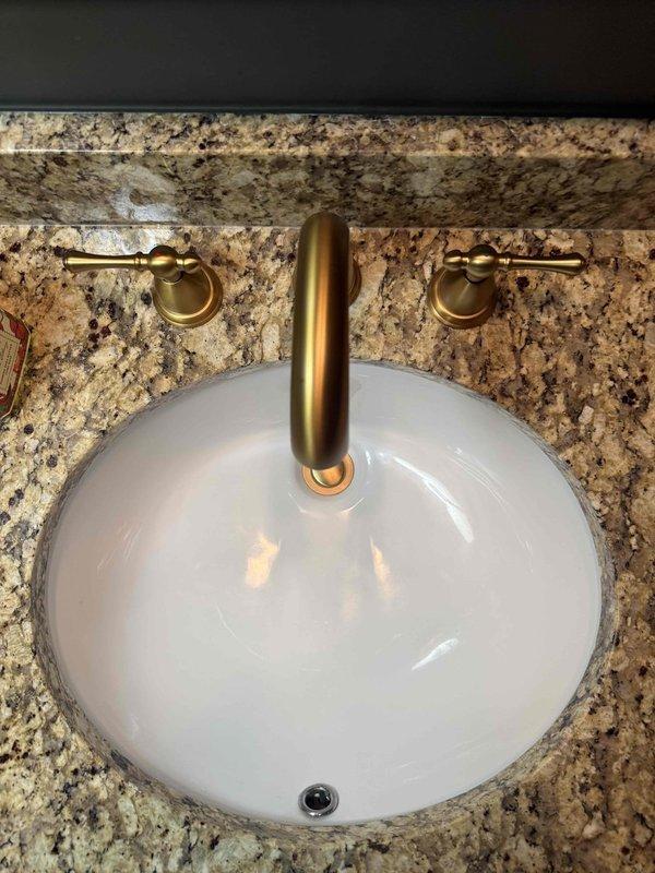 Responded to reports of a leak under the kitchen sink and running toilets. Inspected the plumbing system, including water pressure at the water heater's pressure gauge (reading approximately 100 psi), and inspected the vanity sink and faucet assembly, which showed no visible damage, staining, or buildup. Performed repairs to address the leak and the running toilets, restoring proper operation. Responded to reports of a leak under the kitchen sink and running toilets. Inspected the plumbing system, including water pressure at the water heater's pressure gauge (reading approximately 100 psi), and inspected the vanity sink and faucet assembly, which showed no visible damage, staining, or buildup. Performed repairs to address the leak and the running toilets, restoring proper operation.