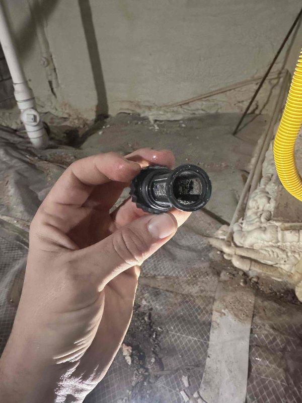 Inspected a wall-mounted Navien tankless water heater with condensate pump, expansion tank, and PVC venting in preparation for descaling and flushing service. Found the inlet water filter screen heavily clogged with sediment and debris, indicating the unit requires a flush and filter cleaning to restore proper flow and efficiency; the customer also requested the same service for a second unit at an additional property. Inspected a wall-mounted Navien tankless water heater with condensate pump, expansion tank, and PVC venting in preparation for descaling and flushing service. Found the inlet water filter screen heavily clogged with sediment and debris, indicating the unit requires a flush and filter cleaning to restore proper flow and efficiency; the customer also requested the same service for a second unit at an additional property.