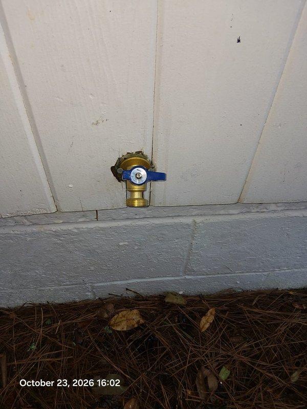 Replaced deteriorated cast iron drain piping with Schedule 40 PVC DWV, including a new P-trap and shielded rubber couplings with stainless clamps to transition to the existing drain line, and re-soldered affected copper supply connections with new fittings. Removed and replaced the exterior hose bib with a new brass lever-handle sillcock, secured to the wall and sealed at the siding penetration. Replaced deteriorated cast iron drain piping with Schedule 40 PVC DWV, including a new P-trap and shielded rubber couplings with stainless clamps to transition to the existing drain line, and re-soldered affected copper supply connections with new fittings. Removed and replaced the exterior hose bib with a new brass lever-handle sillcock, secured to the wall and sealed at the siding penetration.