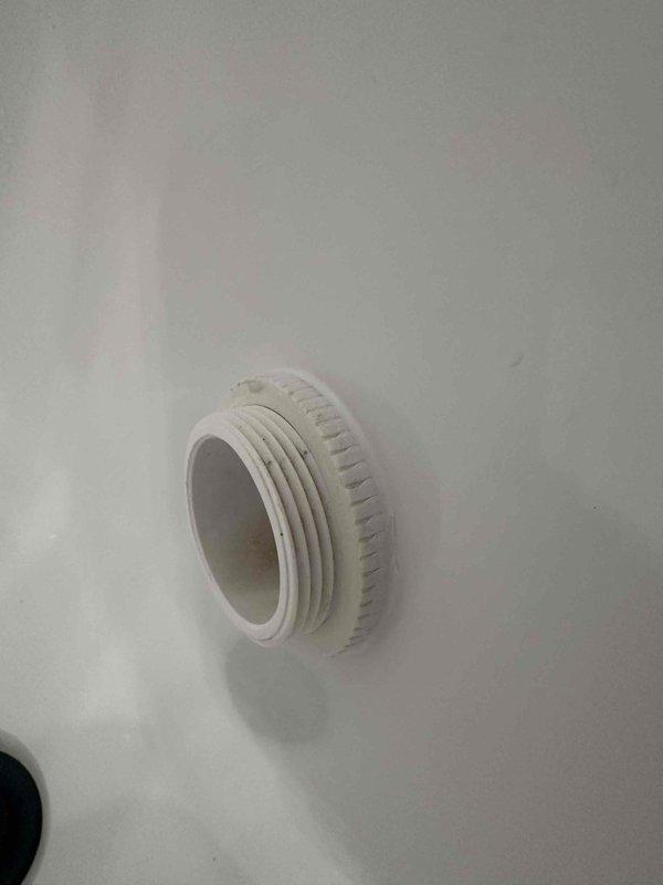 Inspected the bathtub overflow/drain assembly above the affected ceiling and identified a failed seal at the threaded plastic drain fitting, where the gasket showed wear and residue buildup. Removed the fitting, cleaned the mating surfaces, and reinstalled it with a new gasket and sealant to restore a watertight connection. Pressure-tested the tub by filling and draining it, confirming no further leakage into the ceiling below. Inspected the bathtub overflow/drain assembly above the affected ceiling and identified a failed seal at the threaded plastic drain fitting, where the gasket showed wear and residue buildup. Removed the fitting, cleaned the mating surfaces, and reinstalled it with a new gasket and sealant to restore a watertight connection. Pressure-tested the tub by filling and draining it, confirming no further leakage into the ceiling below.