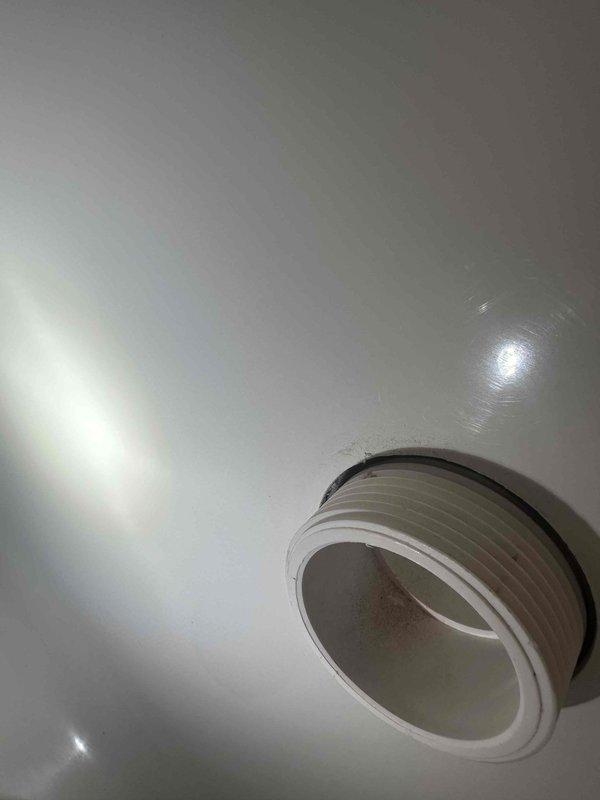 Inspected the bathtub overflow/drain assembly above the affected ceiling and identified a failed seal at the threaded plastic drain fitting, where the gasket showed wear and residue buildup. Removed the fitting, cleaned the mating surfaces, and reinstalled it with a new gasket and sealant to restore a watertight connection. Pressure-tested the tub by filling and draining it, confirming no further leakage into the ceiling below. Inspected the bathtub overflow/drain assembly above the affected ceiling and identified a failed seal at the threaded plastic drain fitting, where the gasket showed wear and residue buildup. Removed the fitting, cleaned the mating surfaces, and reinstalled it with a new gasket and sealant to restore a watertight connection. Pressure-tested the tub by filling and draining it, confirming no further leakage into the ceiling below.