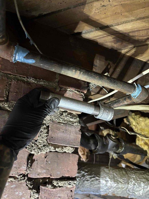 Located and repaired gas leaks on the black iron supply piping at the water heater and in the crawlspace by replacing deteriorated pipe nipples and fittings, sealing threaded joints with approved gas-rated pipe dope, and removing corroded sections. Pressure tested the repaired lines, verified no leaks remained, and restored gas service to the home. Located and repaired gas leaks on the black iron supply piping at the water heater and in the crawlspace by replacing deteriorated pipe nipples and fittings, sealing threaded joints with approved gas-rated pipe dope, and removing corroded sections. Pressure tested the repaired lines, verified no leaks remained, and restored gas service to the home.