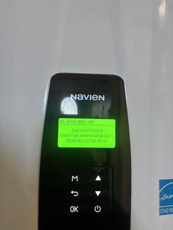Diagnosed a Navien tankless water heater that was intermittently shutting down with a blinking red indicator during extended demand, and the controller logged Error 003 (Ignition Failure). Inspection of the ignition electrode assembly revealed oxidized, chalky buildup on the electrodes and bent, misaligned tips, which prevented reliable ignition and flame sensing. The ignition assembly was removed and found to be deteriorated, and the unit was serviced to restore proper ignition and sustained operation. Diagnosed a Navien tankless water heater that was intermittently shutting down with a blinking red indicator during extended demand, and the controller logged Error 003 (Ignition Failure). Inspection of the ignition electrode assembly revealed oxidized, chalky buildup on the electrodes and bent, misaligned tips, which prevented reliable ignition and flame sensing. The ignition assembly was removed and found to be deteriorated, and the unit was serviced to restore proper ignition and sustained operation.