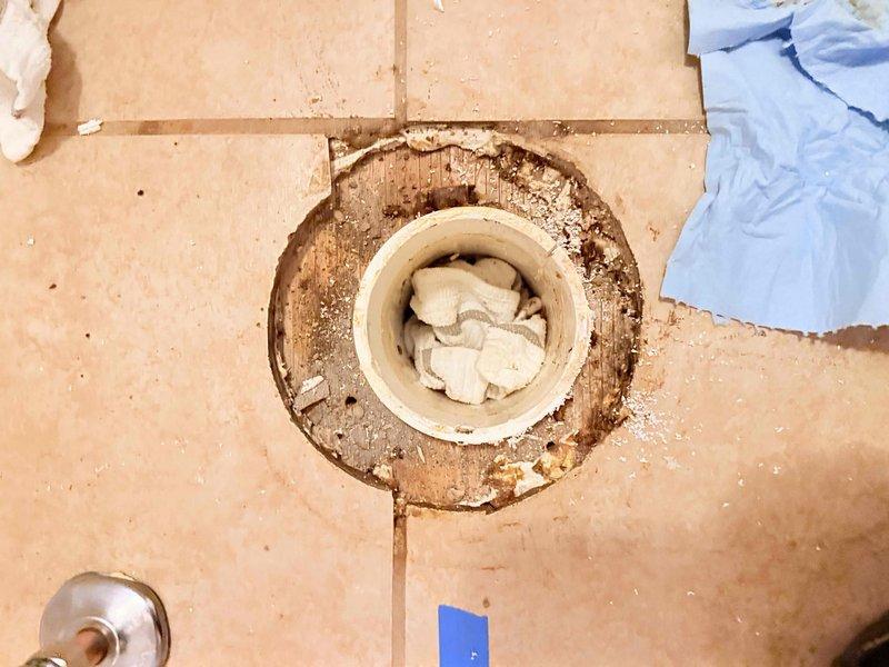 Inspected a failed DIY toilet replacement and found a corroded, unlevel closet flange with deteriorated subfloor around the drain opening. Removed the damaged flange and compromised material, repaired the flange mounting surface, and reset the flange level and secure to the finished floor. Installed the toilet on a new wax seal with fresh closet bolts, then confirmed a stable, leak-free connection. Inspected a failed DIY toilet replacement and found a corroded, unlevel closet flange with deteriorated subfloor around the drain opening. Removed the damaged flange and compromised material, repaired the flange mounting surface, and reset the flange level and secure to the finished floor. Installed the toilet on a new wax seal with fresh closet bolts, then confirmed a stable, leak-free connection.