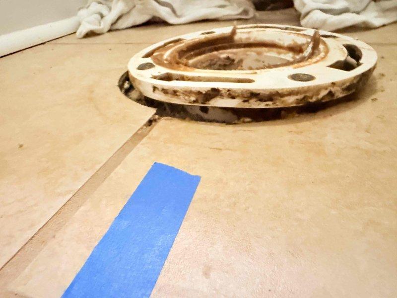 Inspected a failed DIY toilet replacement and found a corroded, unlevel closet flange with deteriorated subfloor around the drain opening. Removed the damaged flange and compromised material, repaired the flange mounting surface, and reset the flange level and secure to the finished floor. Installed the toilet on a new wax seal with fresh closet bolts, then confirmed a stable, leak-free connection. Inspected a failed DIY toilet replacement and found a corroded, unlevel closet flange with deteriorated subfloor around the drain opening. Removed the damaged flange and compromised material, repaired the flange mounting surface, and reset the flange level and secure to the finished floor. Installed the toilet on a new wax seal with fresh closet bolts, then confirmed a stable, leak-free connection.