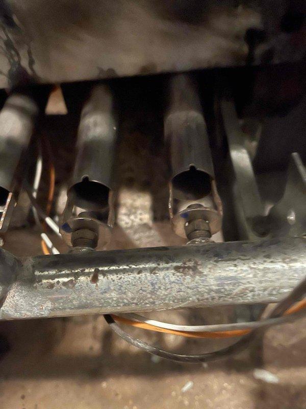 Responded to no heat complaint on steam boiler system. Inspected electronic control module with multiple terminal connections and verified proper voltage to components. Examined piping assembly and mechanical connections as part of troubleshooting process. System restored to proper operation.