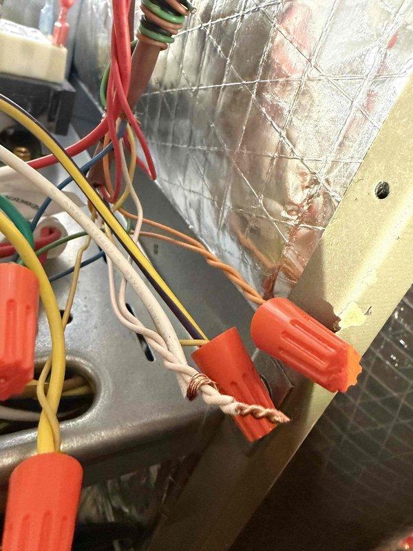 Responded to callback for recent installation where customer reported heating system not exceeding 65°F despite 70°F thermostat setting. Inspected electrical connections in control panel, verified proper wiring configuration with no loose connections. Temperature readings using digital thermometer showed discharge temperature of 91.9°F, confirming system is producing adequate heat. Determined issue was likely thermostat calibration. Recalibrated thermostat and confirmed proper operation with customer.