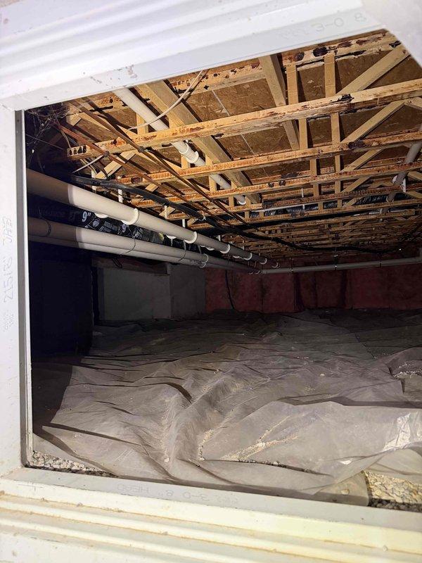 Responded to furnace blower motor noise complaint from new customer. Upon inspection of crawl space, identified improper pitch in HVAC condensate drain line causing ice formation at connection points. Marked affected area and corrected drainage slope to prevent future condensate buildup and eliminate noise issue.