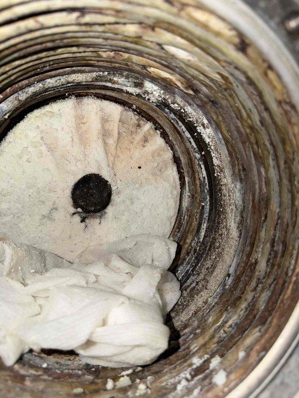 Responded to commercial no-heat service call. Upon inspection, found significant mineral scaling and residue buildup inside heat exchanger. Unit inspection revealed possible issues with blower motor assembly and control board connections. Recommended thorough cleaning and further diagnostics to restore proper heating function.
