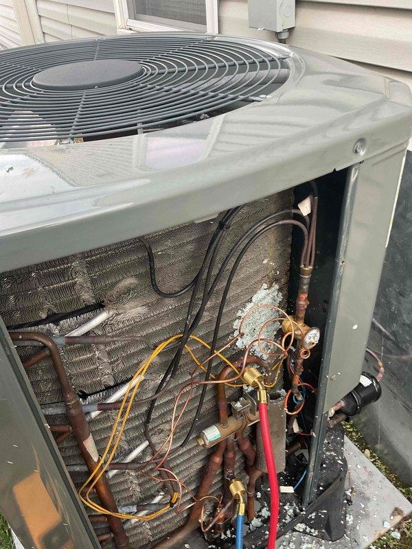 Completed replacement of thermostatic expansion valve (TXV) on residential air conditioning system that exhibited restricted refrigerant flow, evidenced by frost formation on refrigerant lines and components. System was properly evacuated, charged, and tested to confirm restoration of proper operation.