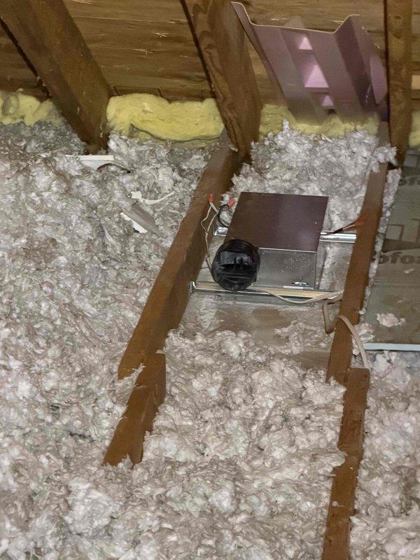 Responded to customer complaint of insufficient heat output from 11-year-old furnace, with home temperature at 62°F. Upon inspection, accessed attic space to examine junction box connections and ductwork, noting disturbed insulation around access point. Repaired electrical connections at junction box and restored proper airflow, resolving the heating performance issue.