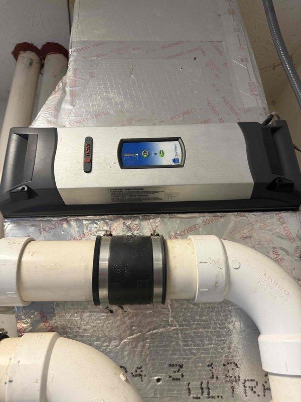 Responded to second opinion request for 15-year-old non-functioning furnace under home warranty coverage. Upon inspection, identified the unit with exposed internal wiring and circuit board components. System appears to be part of an integrated setup with water treatment equipment and visible PVC ventilation pipes. Customer advised that replacement may be necessary due to age and complete heat loss since 11/25.