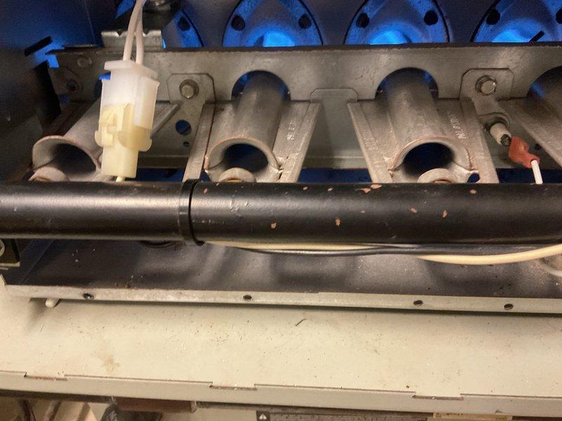 Diagnosed no heat complaint on unit less than 10 years old. Inspected electrical control board and found faulty connection at the flame sensor terminal. Cleaned burner assembly, restored proper flame detection, and verified normal ignition sequence with proper burner operation. Unit is now heating correctly with no issues.