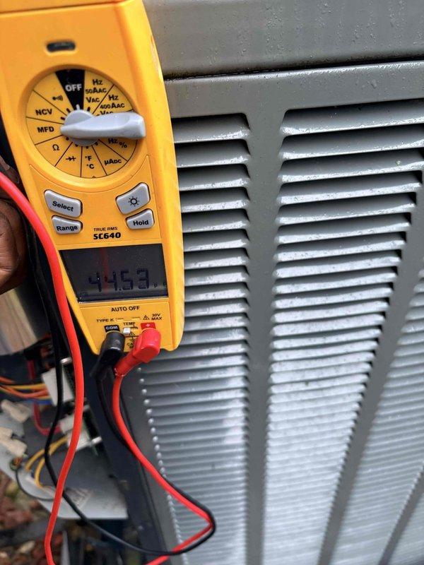 Performed scheduled maintenance tune-up service on HVAC system. Conducted electrical diagnostics using Fieldpiece SC640 multimeter, confirming proper voltage readings of 44.63V. Also tested ambient conditions with digital measurement tool showing 19.9° reading. Customer renewed annual maintenance plan with initial service completed successfully.