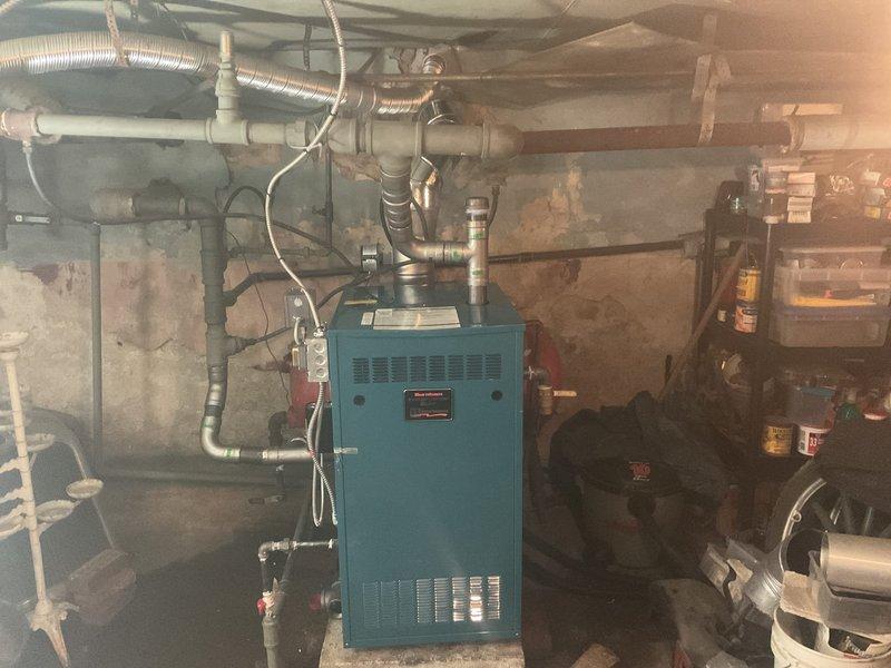 Installed new Burnham low pressure steam boiler (PIN5SNI-ME2) with complete plumbing connections to existing black pipe supplies and returns. System setup included installation of expansion tank, pressure gauge, and all necessary controls and wiring, with boiler additive applied to optimize performance.