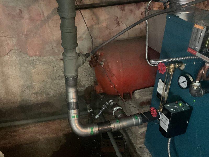 Installed new Burnham low pressure steam boiler (PIN5SNI-ME2) with complete plumbing connections to existing black pipe supplies and returns. System setup included installation of expansion tank, pressure gauge, and all necessary controls and wiring, with boiler additive applied to optimize performance.