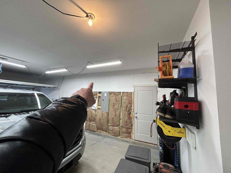 Conducted a site evaluation for mini-split installation in an insulated garage workspace. Inspected existing electrical panel to assess power capacity for the proposed HVAC system. Customer is interested in adding climate control to this workshop area which currently has exposed insulation in some sections.