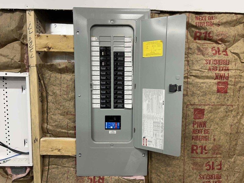 Conducted a site evaluation for mini-split installation in an insulated garage workspace. Inspected existing electrical panel to assess power capacity for the proposed HVAC system. Customer is interested in adding climate control to this workshop area which currently has exposed insulation in some sections.