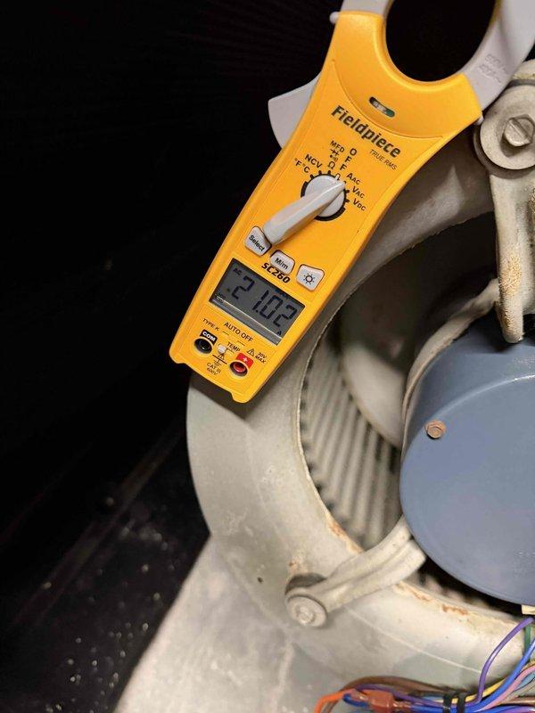 Performed annual heating maintenance on geothermal system. Inspected control board and wiring connections, confirming proper installation with no visible damage. Voltage testing showed readings within normal operating parameters (21.83V), indicating system is functioning correctly.