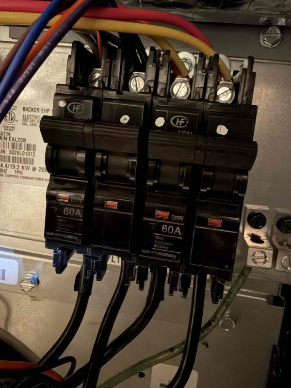 Identified malfunctioning geothermal system that was repeatedly tripping a 60A breaker in the dedicated sub-panel adjacent to the unit. Reset circuit breakers to temporarily restore operation. Installed new communicating thermostat and Symphony module to enable Wi-Fi connectivity for remote system control and monitoring. Parts inventory stored on garage shelf for future maintenance.