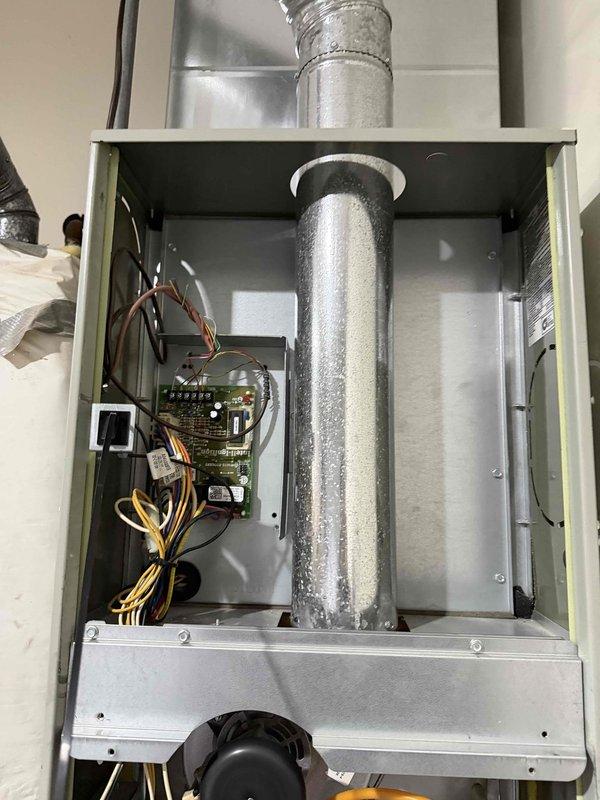 Performed standard tune-up on heating system, including electrical voltage testing showing readings of 376/300 volts. Inspected and verified proper operation of control board connections and wiring integrity. Visual inspection of ductwork and internal components completed with no issues identified.