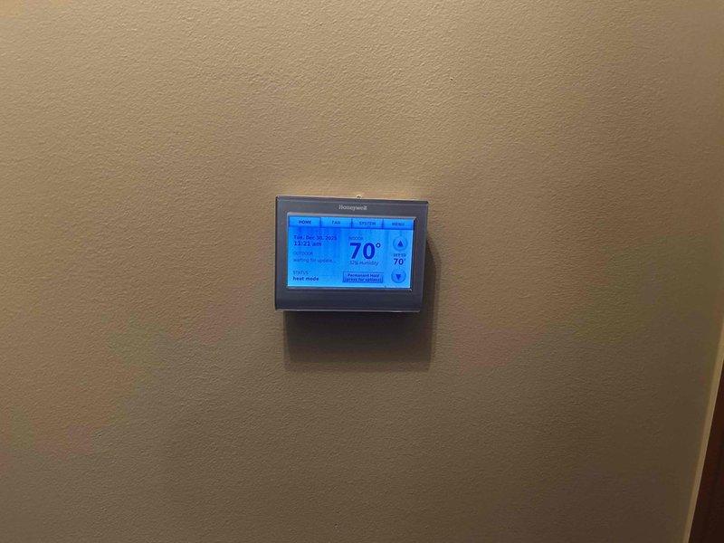 Conducted comprehensive evaluation of existing Bassett furnace system for potential replacement per customer request, following referral from previous clients. Inspected current installation including wall-mounted unit, ductwork with reflective foil insulation, and PVC venting connections. Verified functionality of Honeywell digital thermostat (currently set at 70°F) and assessed overall system compatibility for recommended replacement options.