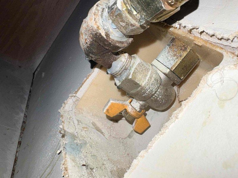 Responded to report of gas leak at Red Maple Grove Townhomes. Inspected plumbing connections showing significant corrosion, mineral buildup, and oxidation on metallic pipe fittings and valves. Confirmed Citizens is still detecting gas leak at the property.