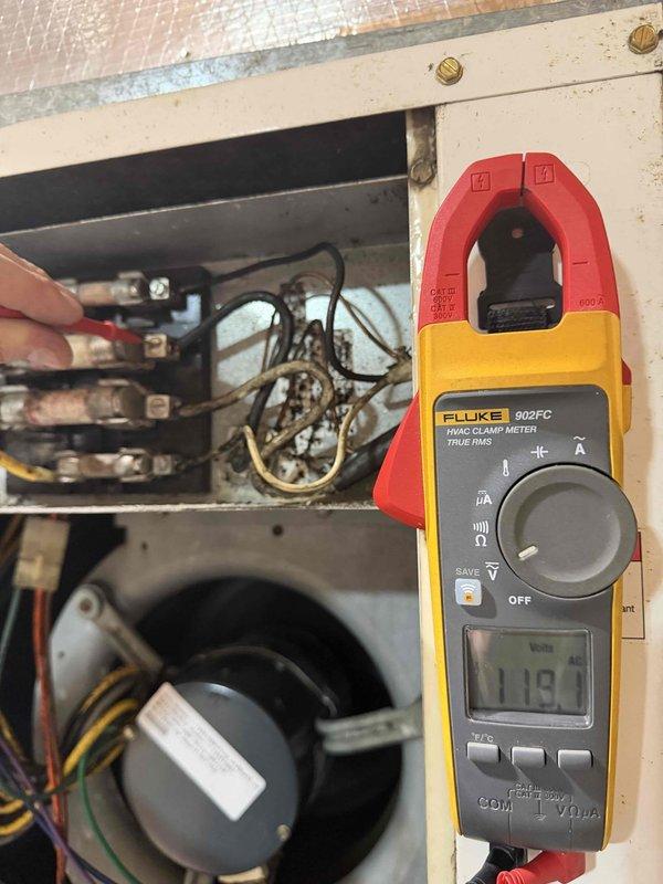 Conducted diagnostic assessment on customer-reported low performance issue with larger geothermal unit in dual-system setup. Performed electrical testing using Fluke 902FC clamp meter to check operational parameters, measuring current draw (11.9A) and inspecting electrical connections within the control panel. Verified functionality of both the existing geothermal unit and the newer installed system to address customer's heating performance concerns.