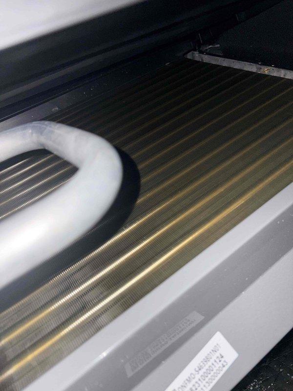 Performed scheduled heating maintenance on system. Inspected and photographed electrical wiring connections in junction box, verifying proper installation with no visible issues. Examined heat exchanger components and cooling coils, noting good condition with no signs of damage or buildup.