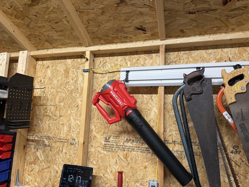 Completed assessment for customer seeking replacement options for garage wall unit heater. Inspected existing unit in workshop area where tools are organized on OSB walls. Customer also requested heating solution for attached workshop space which currently uses a portable space heater. Provided replacement options to improve heating efficiency throughout both connected spaces.