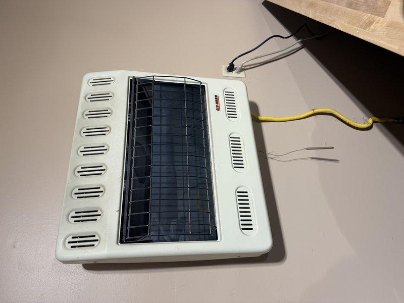 Completed assessment for customer seeking replacement options for garage wall unit heater. Inspected existing unit in workshop area where tools are organized on OSB walls. Customer also requested heating solution for attached workshop space which currently uses a portable space heater. Provided replacement options to improve heating efficiency throughout both connected spaces.