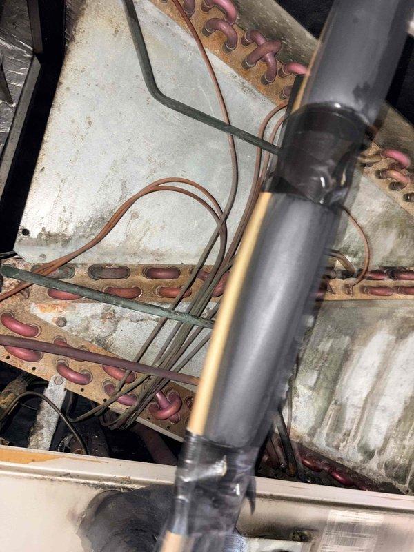 Responded to no-heat call at Mears Machine Corp where maintenance reported furnace not working and leaking condensation. Visual inspection revealed significant corrosion and deterioration on the heat exchanger coils with substantial rust, scale buildup, and mineral deposits. Copper tubes showed oxidation damage consistent with prolonged condensation exposure, confirming maintenance's initial assessment.