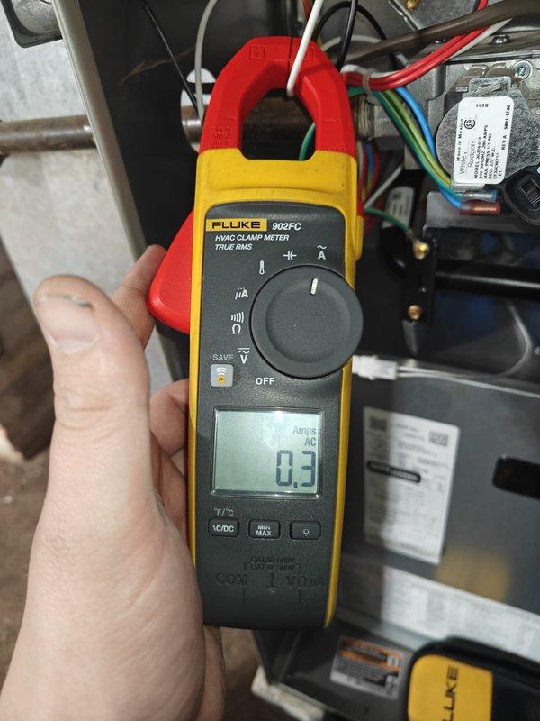 Performed heating maintenance service on system. Conducted electrical inspections using Fluke 902FC clamp meter, measuring amperage draws with readings of 0.3 and 54 amps on various components to verify proper electrical operation of the heating system.