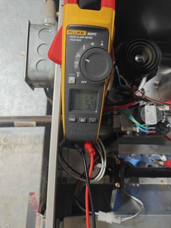 Performed heating maintenance service on system. Conducted electrical inspections using Fluke 902FC clamp meter, measuring amperage draws with readings of 0.3 and 54 amps on various components to verify proper electrical operation of the heating system.