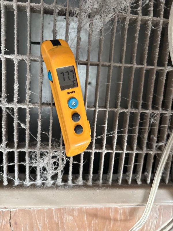 Diagnosed furnace with no heat issue by taking temperature measurements at both the coil (77.7°F) and floor vent (35°F), which confirmed significant heat loss in the system. Found severe dust accumulation on coil fins restricting airflow and installed new gas valve to restore proper heating function.