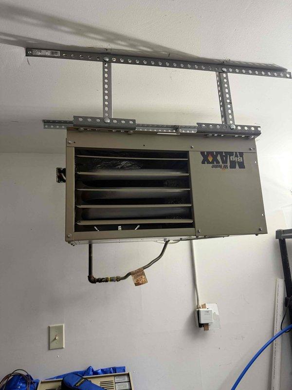 Diagnosed garage furnace cycling issue on 3-year-old Mr. Heater wall-mounted unit that would shut down after reaching temperature and fail to restart. Temperature readings confirmed proper heat output at 83.8°F. Determined fault was in control board sequencing; replaced control module and verified multiple successful heating cycles through complete operation.