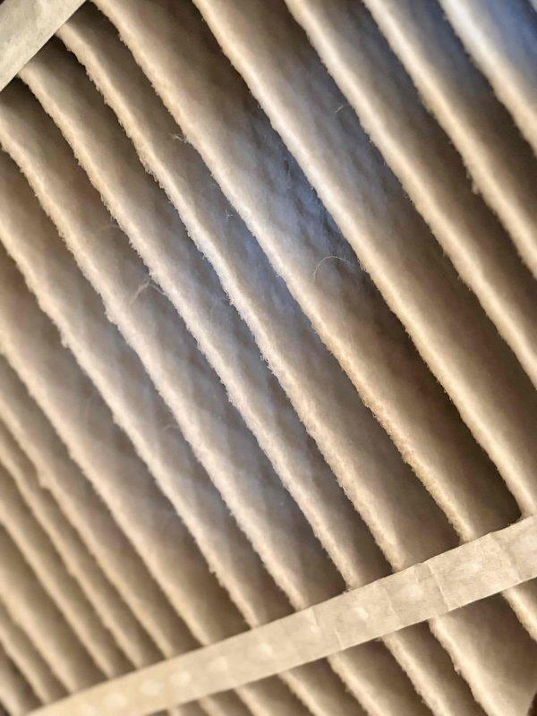 Conducted routine heating maintenance service including inspection and replacement of the air filter, which showed normal dust accumulation. System temperature readings were verified with a digital thermometer, measuring 90.5°F at the insulated ductwork. All components were functioning properly with no issues identified.