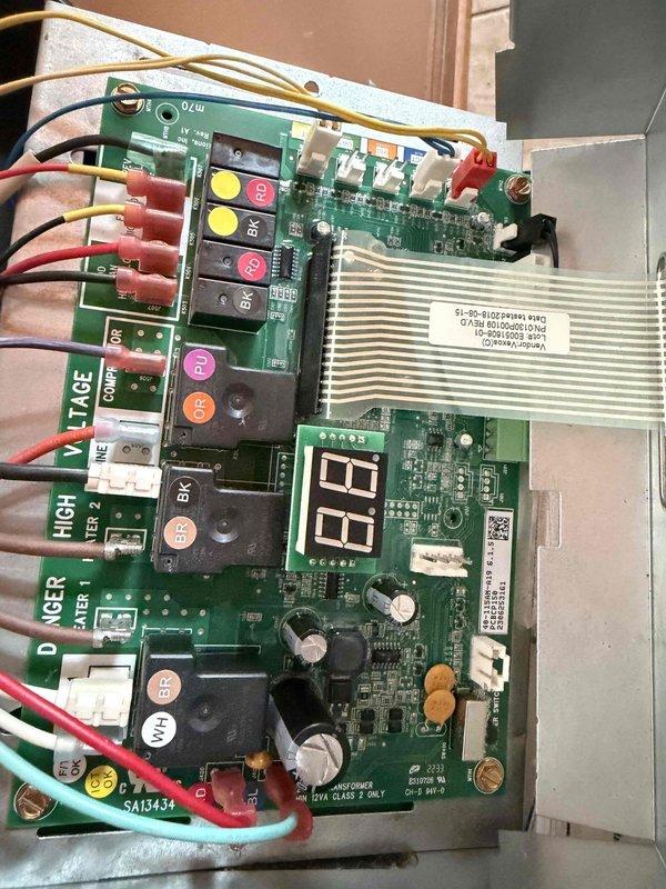 Responded to customer complaint of no heat from mini split system. Inspected control board with digital display and verified proper connections to all terminals. Examined line set insulation and wall-mounted controller. Identified and corrected faulty thermostat communication issue causing heating failure.