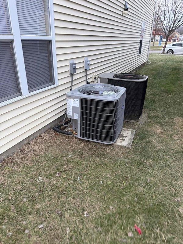 Responded to third call back for inoperative heating system. Diagnosed temperature issue with supply air (80.5°F measured at insulated ductwork). Inspected both outdoor units, verified proper operation of newer model and confirmed electrical connections at disconnect boxes were secure. System now functioning within normal parameters.