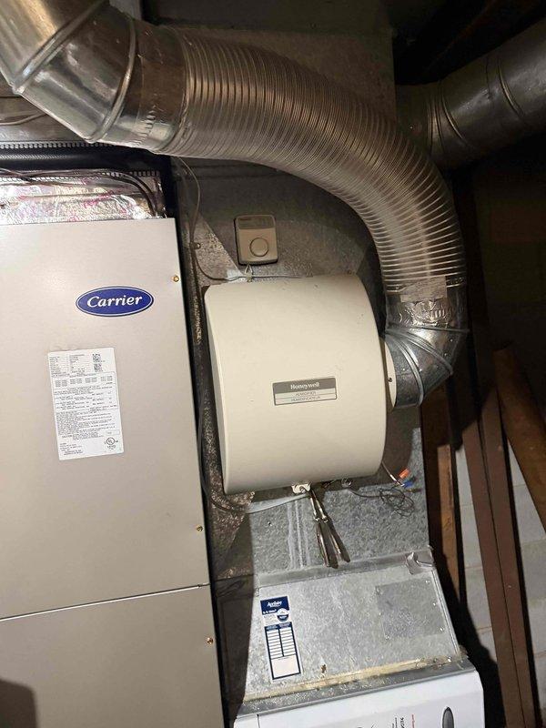 Diagnosed non-functioning humidifier on Carrier HVAC system. Performed electrical testing with Fluke meter, confirming 24.7V power supply to the Honeywell humidifier unit. Inspected connections and ductwork installation, verifying proper integration with the existing system.