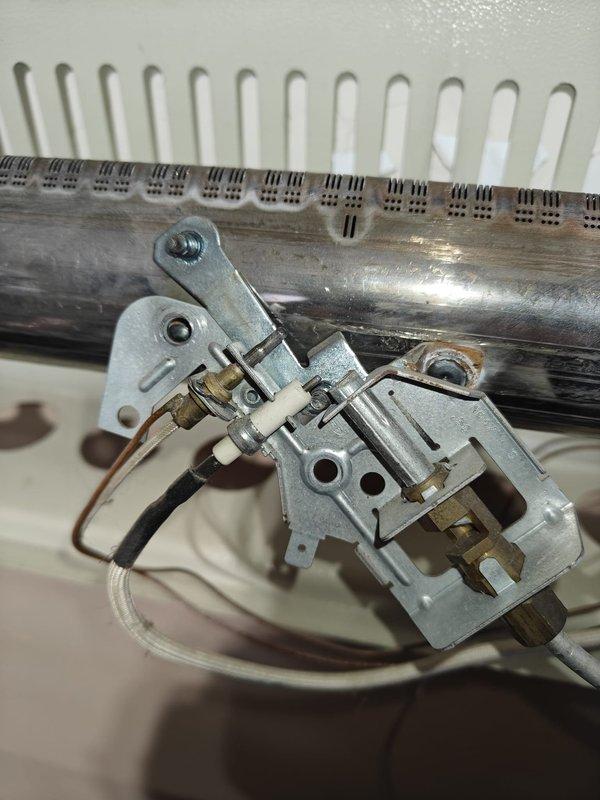 Performed routine tune-up on garage unit HVAC system. Inspected ignition assembly and burner components for proper operation. Removed cover to clean accumulated dust from interior compartment and checked all connections and components for normal wear.