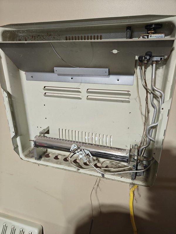 Performed routine tune-up on garage unit HVAC system. Inspected ignition assembly and burner components for proper operation. Removed cover to clean accumulated dust from interior compartment and checked all connections and components for normal wear.