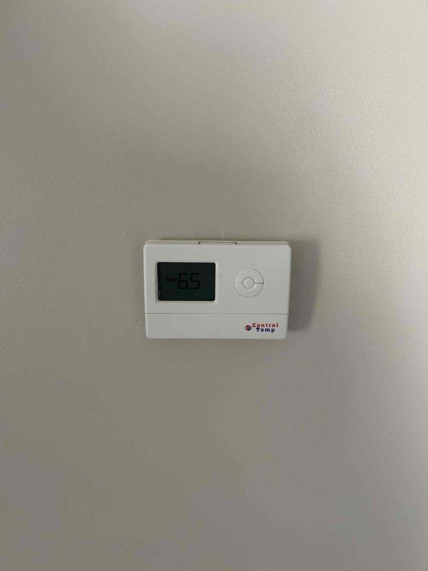 Conducted assessment of existing HVAC system including an aging furnace unit with connected ductwork and a digital Central Temp thermostat (currently reading 65°F). Provided comprehensive replacement estimate for furnace upgrade, considering integration with current water heater, water treatment system, and existing ductwork configuration in the utility room.