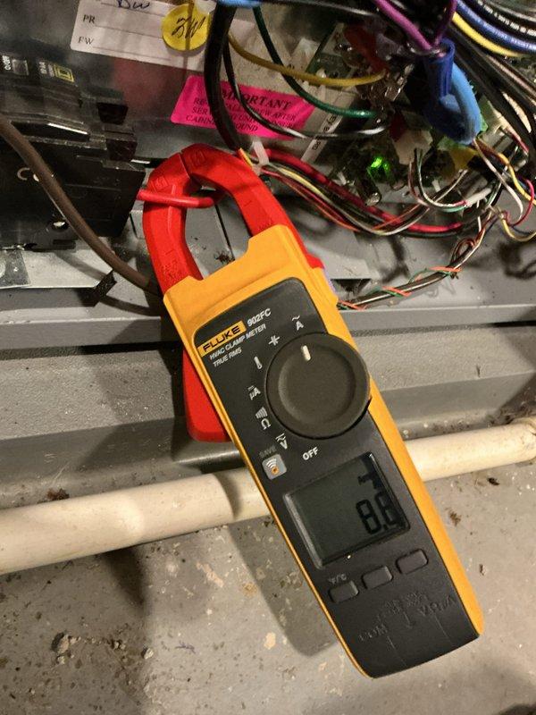 Completed annual heating maintenance on geothermal system. Performed electrical testing on control board connections with Fluke 902FC meter to verify proper operation. Inspected GeoLink manifold assembly and circulation pumps, confirming all connections were secure with no leaks present in the hydronic distribution system.