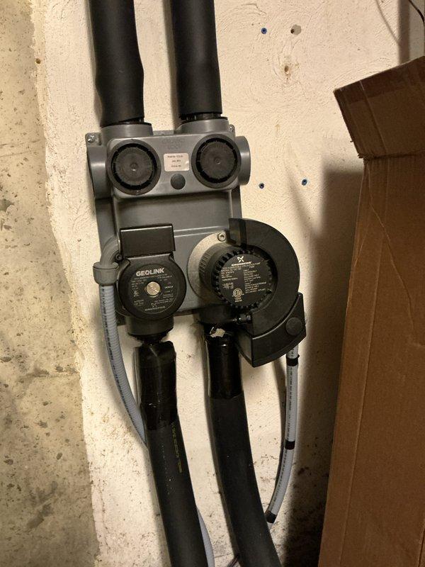 Completed annual heating maintenance on geothermal system. Performed electrical testing on control board connections with Fluke 902FC meter to verify proper operation. Inspected GeoLink manifold assembly and circulation pumps, confirming all connections were secure with no leaks present in the hydronic distribution system.
