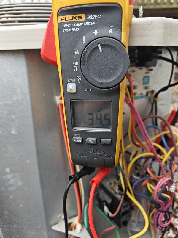 Performed routine maintenance on cooling system, inspecting evaporator coil for proper condition and airflow. Conducted electrical diagnostics using Fluke 902FC meter, verifying system amperage at 345. All components functioning within specifications with no issues detected.