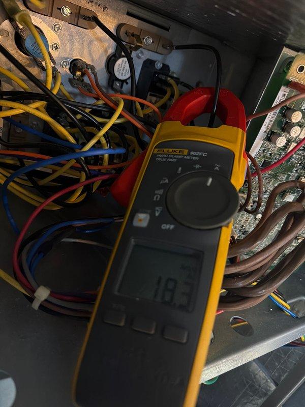Performed annual heating maintenance on Carrier system. Conducted electrical diagnostics using Fluke 902FC clamp meter, measuring 18.3 amp draw on primary components. Inspected outdoor unit condition with special attention to condenser coils and housing integrity despite cold weather conditions.